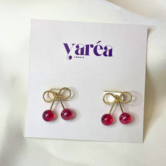 Cherry-themed earrings on a Yarea branded card against a white background